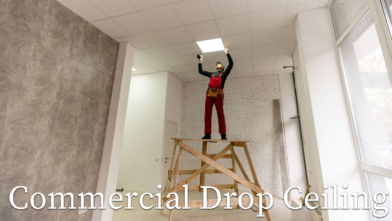 man adding drop ceiling